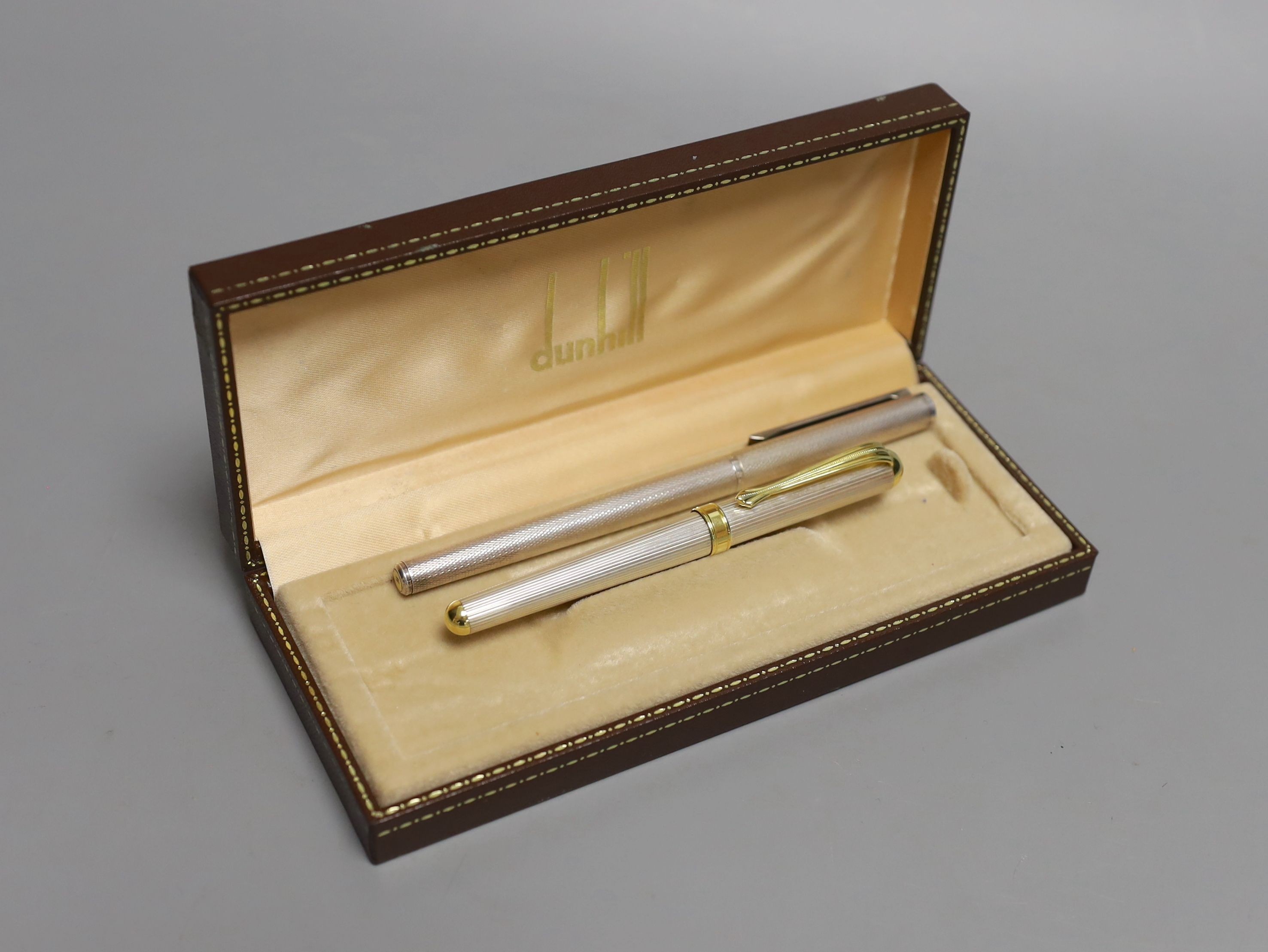 A boxed Dunhill fountain pen together with another fountain pen